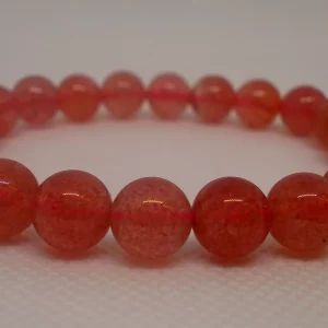 A strawberry quartz bracelet.