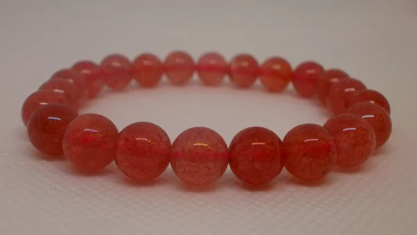 A strawberry quartz bracelet.